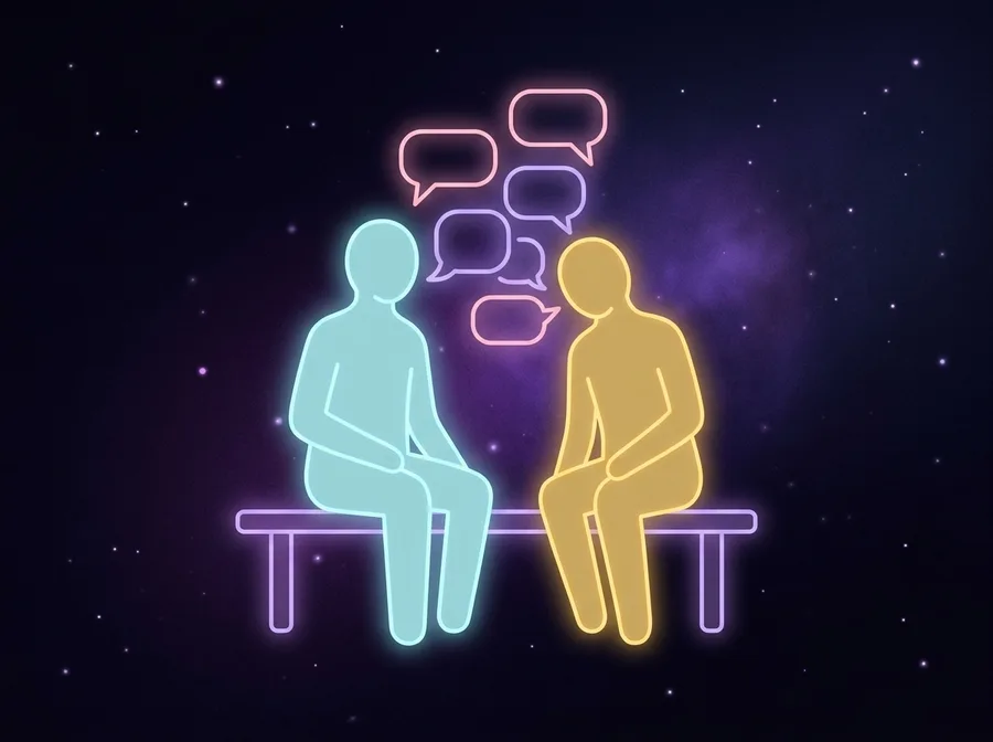 Two people talking on a bench